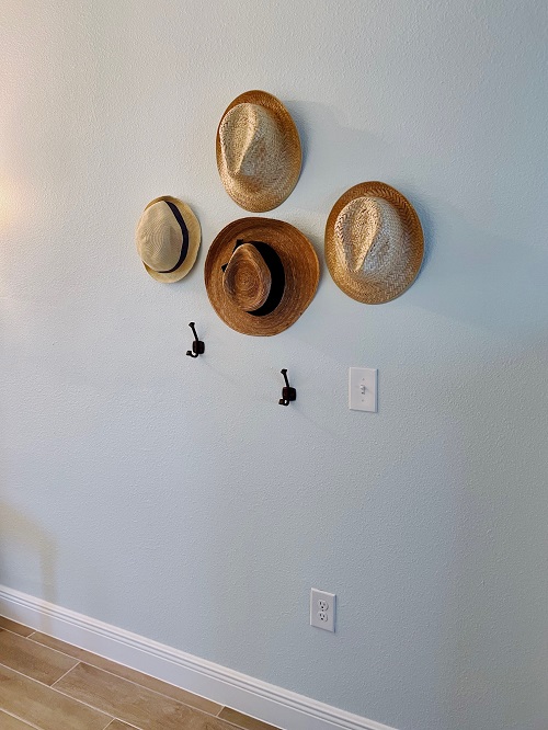 Hat wall missing two hats