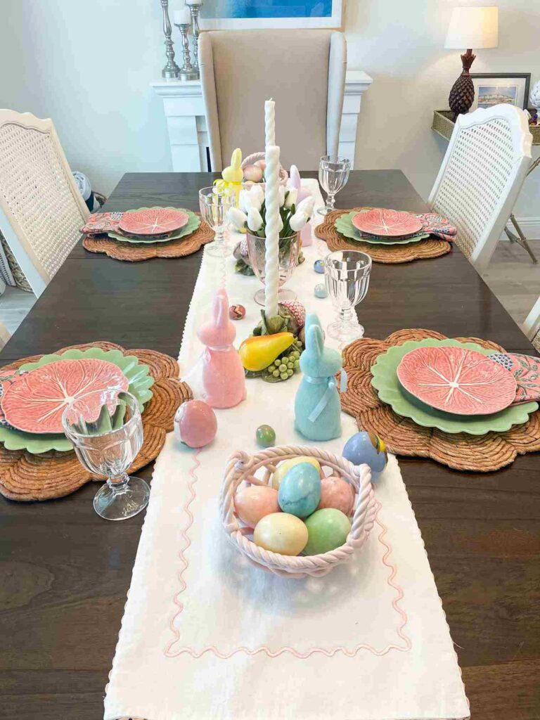 Dark wood table with place settings and Easter decorations