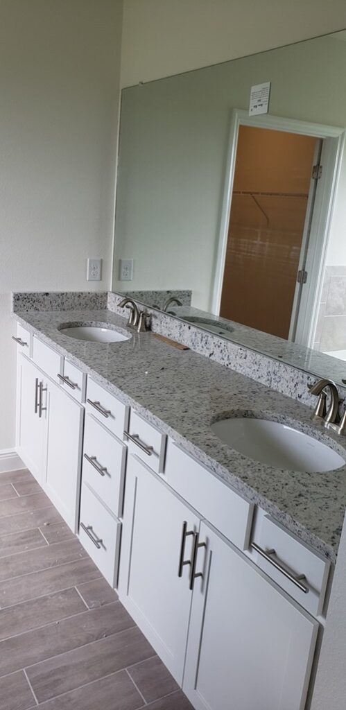 Before of counter, sinks and mirror in bath