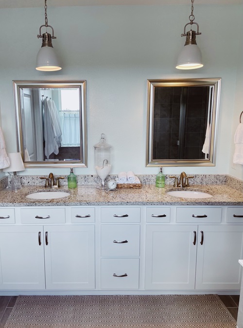 Sinks, mirrors and lights in calm and soothing bathroom design